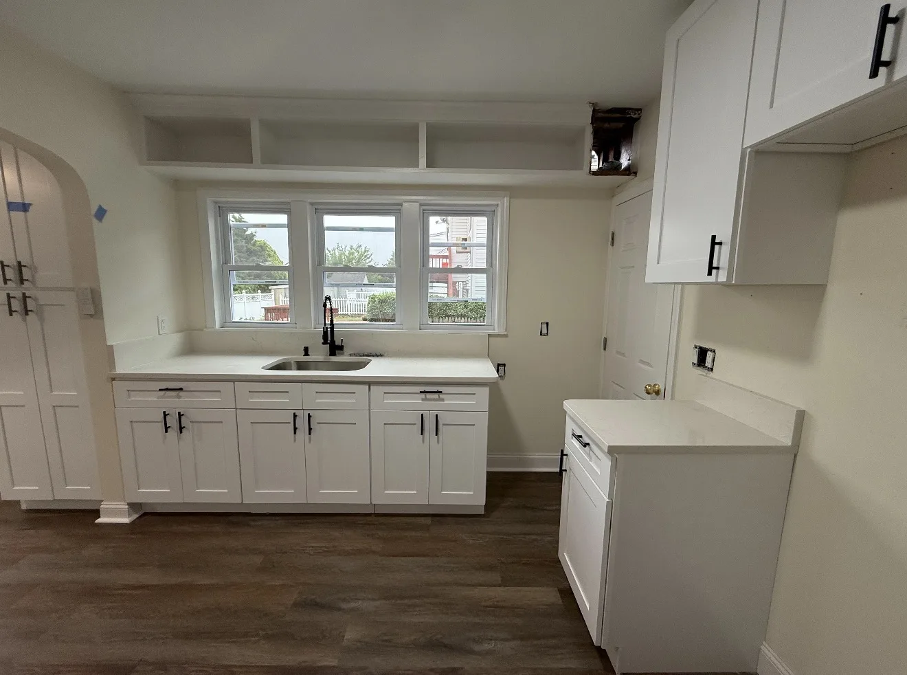 Bright renovated kitchen with white cabinets