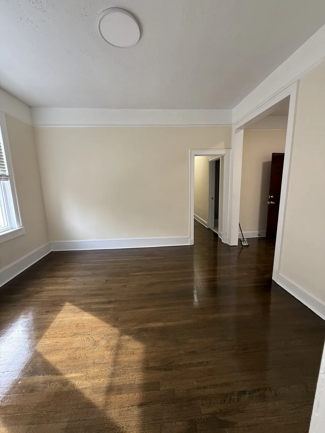 Sunlit living room after painting and refinishing